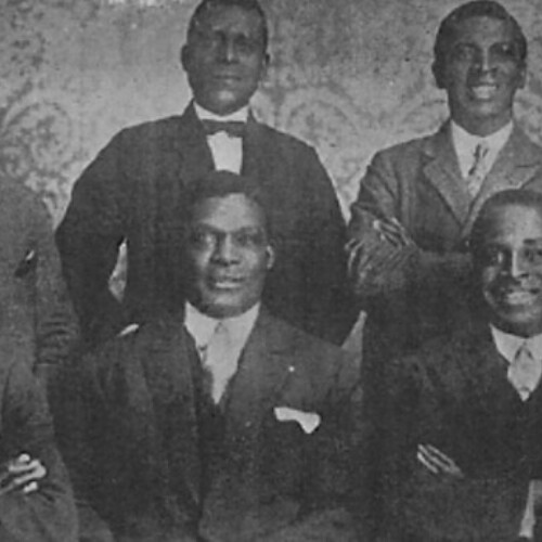 Cameroonian actors in Berlin from left to right, back row: Herman Nganze, Mr. Ndonze, Mr. Debonze, and Evan Ezanze. Front row: Herman Kessen, H. Steinberg, Louis Brody, Joseph Eque Bilé and Madeze Ecoto, about 1929